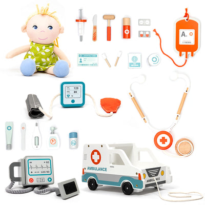Collection of toy medical equipment and a plush baby doll on a white background