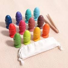 Set of colorful wooden toys with a drawstring bag on a beige background