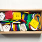 LACING BUTTONS AND LACES IN A WOODEN TRAY
